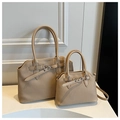 Close-up of beige textured tote bag set with vertical pleated patterns and buckle details - Large / Khaki