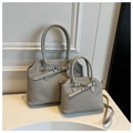 Detail of minimalist tote bag set with vertical pleated texture and silver metal hardware - Large / Gray