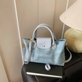 Light blue denim and PU leather tote bag with gold hardware and adjustable strap - Blue