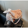 Detail of pink pleated cloud bag featuring a white lace bow and elegant pearl handle - Pink