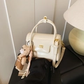 Chic cream patent leather square handbag with golden logo and cute bear pendant - Beige With Charm