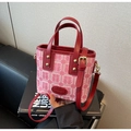 Close-up of pink fabric with red Xi wedding pattern and leather straps for bags - Pink Double Happiness