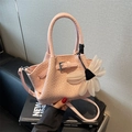 Pink woven texture crossbody bucket bag with floral charm and silver buckle detail - Pink