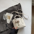 Off-white lychee grain bucket bag with pearl heart charm and adjustable strap - Cream White With Pendant