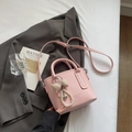 Pink lychee grain leather bucket bag with ribbon bow charm and pearl heart detail - Pink with Pendant