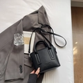 Classic black litchi leather bucket bag with top handles and adjustable shoulder strap - Black without Pendant