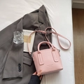 Pink lychee grain leather mini bucket bag with top handles and adjustable shoulder strap - Pink Without Pendant