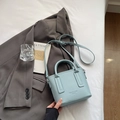 Light blue lychee pattern leather bucket bag with top handles and adjustable strap - Blue Without Charm
