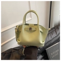 Detailed macro view of the light green lychee grain leather and metal buckle detail - Green