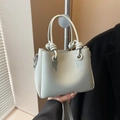 Pale green lychee texture mini bucket bag with unique knot handles and clearok logo - Blue Without Charm