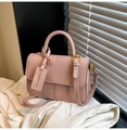 Detail of pink contrast crossbody bag with woven texture panels and gold hardware - Pink