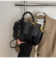Modern black and dark grey contrast crossbody bag with elegant gold hardware and logo tag - Black