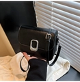 Minimalist black rectangular crossbody bag with silver buckle and leather texture - Black