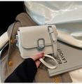 Elegant white square crossbody bag with textured silver lock and thin shoulder strap - White