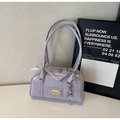 Detail of lavender Boston bag with glossy finish and ribbon bow charm decoration - Purple With Pendant