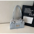 Light blue patent leather bowling shoulder bag with decorative bows and metallic logo plate - Blue Without Charm