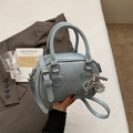 Light blue PU leather pillow bag with heart decor and beaded charm shown on a desk - With Pendant / Blue