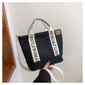 Chic black canvas tote bag with GENTLEWOMAN lettered straps and crossbody sling - Black and White