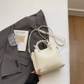 Chic beige lychee textured leather bucket bag with knotted handle and adjustable strap - Rice White (No Pendant)