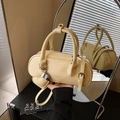Pale yellow leather bowling bag with heart charm and matching shoulder strap - Yellow