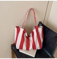 Red and white striped canvas tote bag variant on chair with modern artistic vibe - Wide Stripe Red