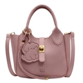 Pale pink lychee grain leather handbag with gold twist lock and dog bag charm accessory - Pink