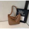 Detail of a brown nylon tote bag featuring a front zipper pocket and adjustable strap - Brown