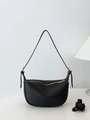 Fashionable black pebbled leather half-moon shoulder bag with golden metal zipper detail - Black