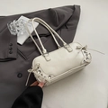 Elegante borsa bowling in pelle lucida beige con fiocchi laterali e doppi manici - Bianco