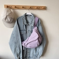 Large light purple nylon crossbody dumpling bag styled casually over a denim jacket - Lilac Small