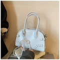 Detailed view of light blue Boston handbag with pearl bow charm and woven stitching decoration - With Pendant / Blue