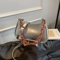 Silver metallic dumpling bag with pink chunky chain handle and adjustable crossbody strap - Silver