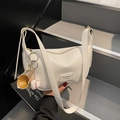 White crescent PU leather shoulder bag with lychee texture and sports theme charm - White with Pendant