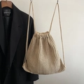 Minimalist beige crochet drawstring backpack featuring a hollow knit texture and thin straps - Khaki