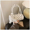 Close-up of white polka dot cylinder bag featuring lace bow and pearl charm detail - With Charm Style / White with Pendant