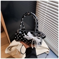 Detail of black polka dot barrel bag with white lace bow and pearl pendant charm - With Charm Style / Black with Pendant
