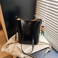 Chic black crinkle leather bucket bag with elegant pearl charm and shoulder strap - With Charm / Black