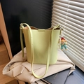 Lime green PU leather bucket bag with adjustable strap and pearl doll charm detail - With Charm / Green