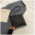 Minimalist black bucket bag with a smooth finish and sleek shoulder strap - No Pendant / Black