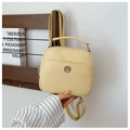 Detail of light yellow PU leather mini backpack with metal logo and adjustable straps - Yellow
