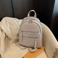 Beige lychee pattern leather backpack with silver zippers and stylish urban design - Gray