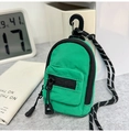 Mini bolso de nailon verde con cremallera y cordón trenzado sobre escritorio - Verde Turquesa