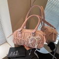 Chic pink pleated barrel handbag with pearl bow charm and elegant lace ribbon detail - Pink