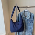 Minimalist navy nylon crescent crossbody tote bag with adjustable shoulder strap - Blue