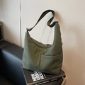 Deep green nylon tote bag featuring a spacious hobo design and adjustable strap - Green