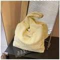 Detail of yellow pleated bubble texture fabric on a Korean style tote bag - Yellow