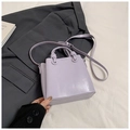 Minimalist light purple leather bucket bag with top handles and adjustable shoulder strap - Purple (No Charm)