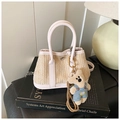 Detailed texture of straw woven bag with pink leather trim and cute bear charm - White (with Pendant)