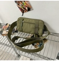 Detail of army green tactical waist bag with durable nylon fabric and reinforced straps - Army Green