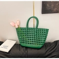 Detail of green hollowed-out silicone beach bag with woven texture and floral decoration - Green